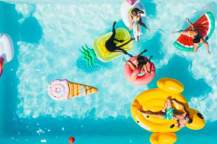 a group of people swimming in the water of Washington State Park Concessions