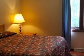 a bedroom with a large bed in a hotel room