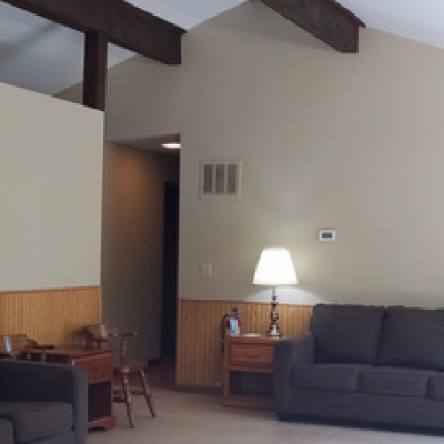a living room filled with furniture and a flat screen tv