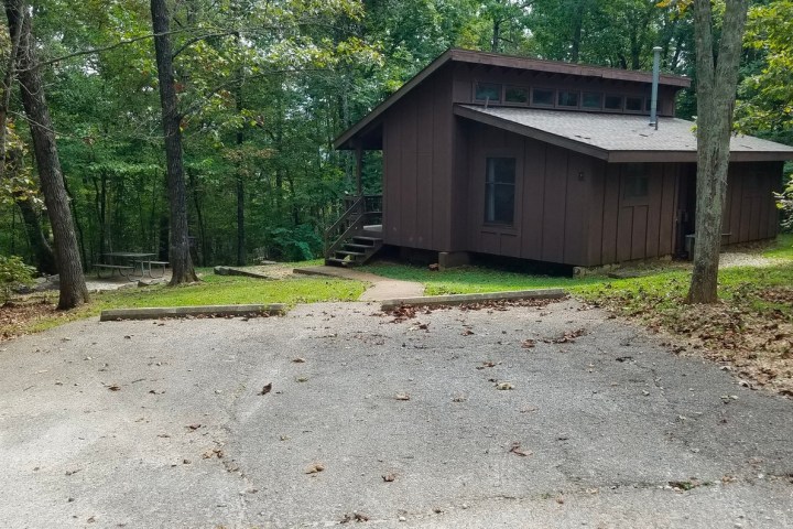 a path with grass in front of a house