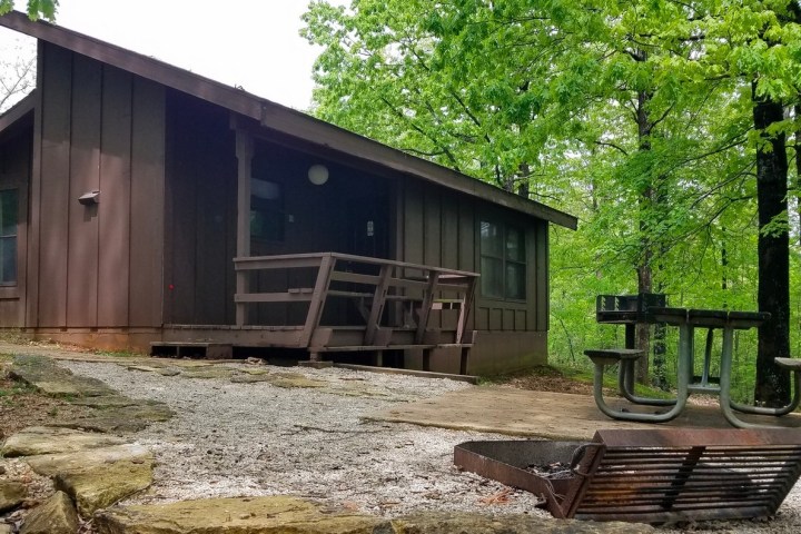a wooden bench in front of a house