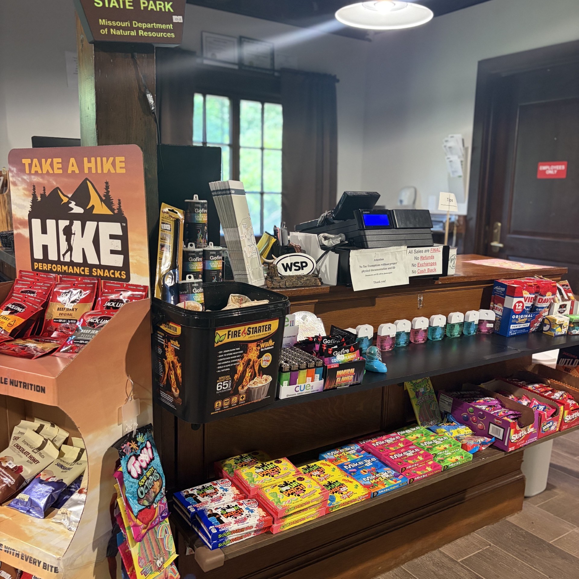 Snack display at Washington State Park gift shop with various treats and hiking snacks.